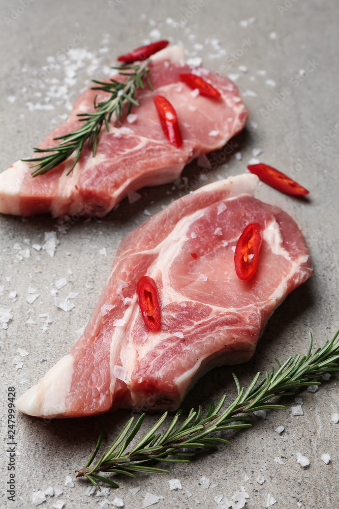 Tasty raw meat on grey background
