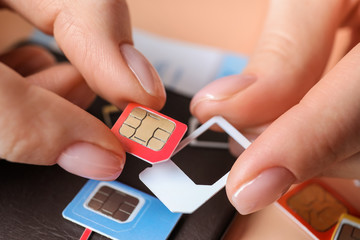 Female hands with sim cards, closeup