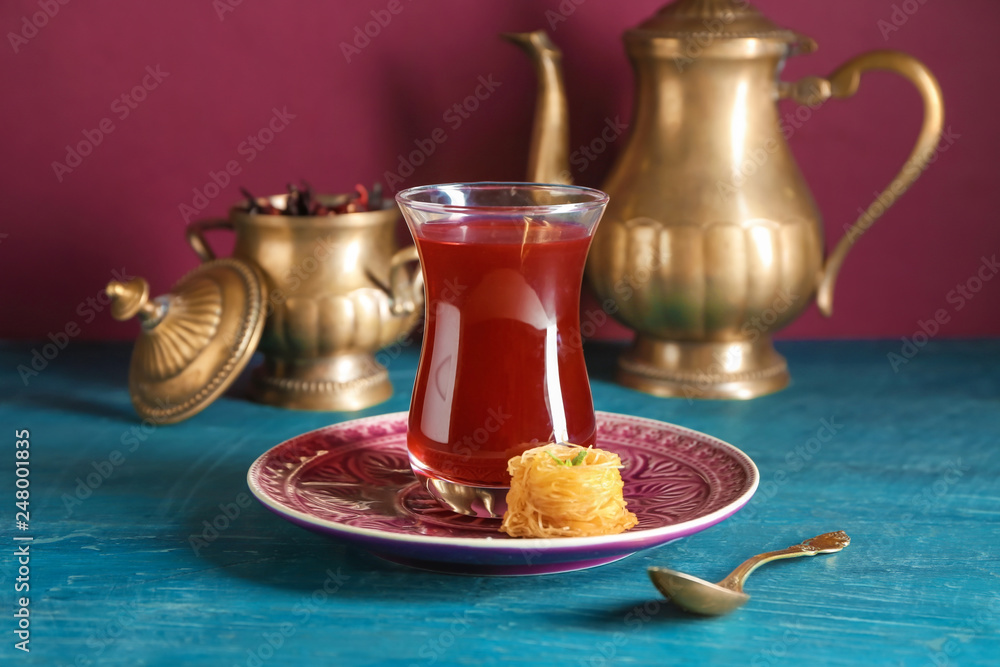 Glass of tasty Turkish tea on table