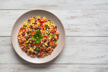 Wall Mural - Mexican black bean corn quinoa salad on the table.