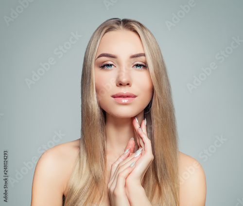 Attractive Woman With Long Healthy Blonde Hair And Clear Skin