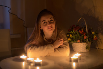 girl at the table with candles