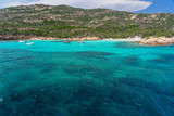 Fototapeta Most - Yachts and boats anchored at beautiful beach of archipelago la Maddalena. Sardinia, Italy