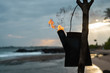 Tiki torches with a bright orange Hawaiian sunset