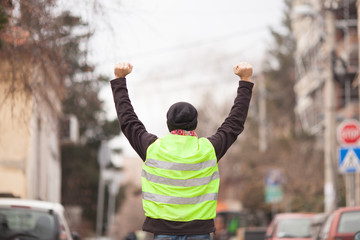 yellow vest political activist protesting on street