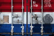 A Closeup Of A Container With The National Flag Of The Netherlands. The Concept Of Export-import The Netherlands And The National Delivery Of Goods.