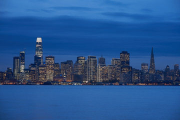 Downtown San Francisco skyline during evening blue hour.