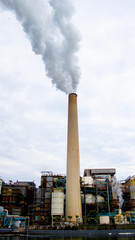 Power plant Smoke Pipes with Industrial Equipment in the background.