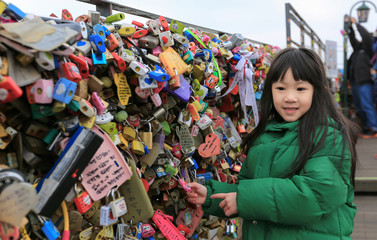 asian littel girl pictures with the keys locked, love padlocks and keys wish love forever at n seoul