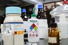 Bottle Of Methanol And Chemical With Hazard Symbols For Experiment In Laboratory.
