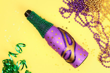 Diy Mardi Gras Bottle Purple Adhesive Paper, Green Bead, Carnival Mask, Sequins Yellow Background.