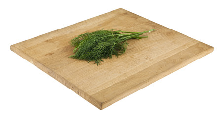 Sticker - dill on a wooden board isolated on white background