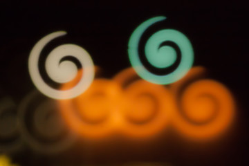 Wall Mural - Blurred photo of defocused bokeh colorful lights in the shape of spiral