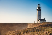 Yaquina Head Lighthouse And Sunset