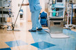 © karrastock - Concept photo of A hospital worker doing cleaning in operation room