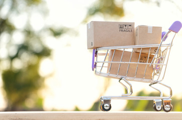 Paper boxes in a trolley with copy-space,Shopping online concept