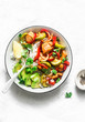 Roasted chicken breast, vegetables and rice bowl - delicious diet balanced lunch on a light background, top view