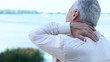 © motortion - Senior businessman touching aching neck, sedentary lifestyle consequences