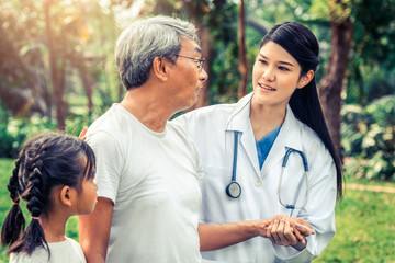 Poster - Friendly doctor taking care of senior man in the hospital garden. Medical and healthcare doctor service concept.