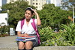 © dtiberio - Cute Colombian Girl Student And Confusion Sitting