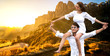 © InfiniteFlow - Happy couple of man carrying woman on neck and shoulders on vacation.