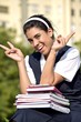 © dtiberio - School Girl And Peace Sign Wearing Uniform With Notebooks