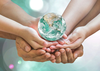 green globe in family volunteer hands for earth day and csr with people concept. elements of this im