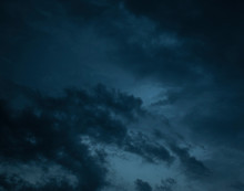 Cloudy Blue Sky With Dark Blue Clouds