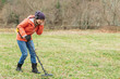 © _KUBE_ - young woman enthusiastically explores the soil with a detector