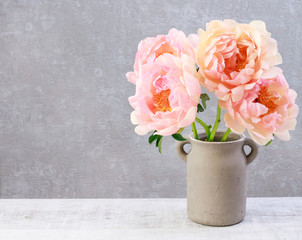 Canvas Print - Bouquet of pink peonies on grey stone background