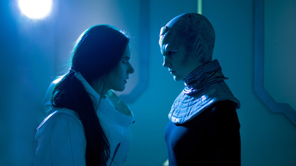 Wall Mural - Woman and an alien look at each other. Contact with other civilizations.