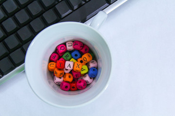 Tax on wooden block and keyboard with tax alphabet