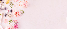 Makeup Products And Make-up Brush With Pink Flowers On Pastel Background. Panoramic Banner With Copy Space For Text. Luxury Beauty.