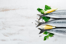 Mackerel On A White Wooden Background. Raw Fish Top View. Free Copy Space.