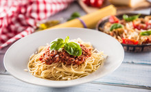 Close Up Italian Pasta Spaghetti Bolognese In White Plate