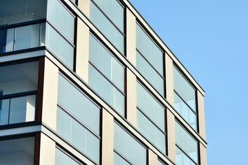 Modern apartment buildings on a sunny day with a blue sky. Facade of a modern apartment building