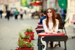 © ElenaBatkova - Pretty brunette having cup of espresso in cafe, browsing internet on smartphone