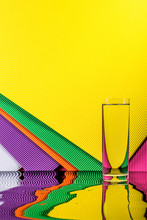 Abstract Still Life With A Glass Of Water On A Color Bright Background