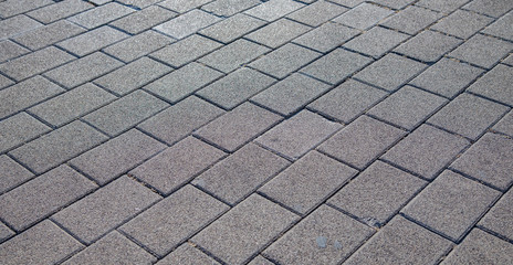 Cobblestones pattern viewed from above as a full frame texture, background.