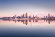 Beautiful Colorful Sunrise Lighting Up The Skyline And The Reflection Of Dubai Downtown. Dubai, United Arab Emirates.