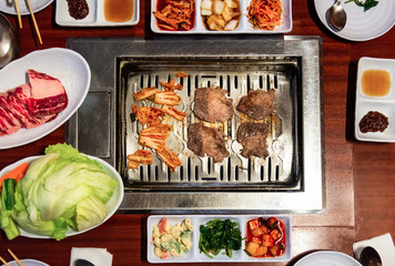 Wall Mural - Traditional Korean meal with barbeque and vegetables