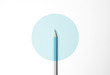 Blue pencil on white background, minimalism. Creativity, idea, solution, creativity concept.