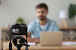 Digital camera filming commercial vlog of man teacher vlogger coach