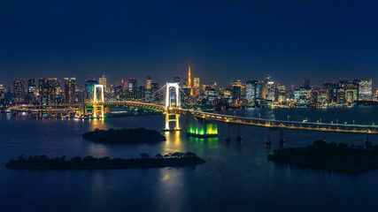 Fototapete - Panorama of tokyo cityscape and rainbow bridge at night.