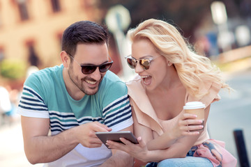 Wall Mural - Young couple with digital tablet