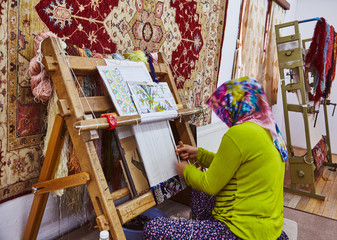 Persian carpet tailoring women in headcloth