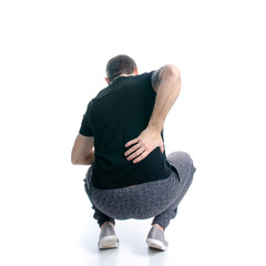 Man in black t-shirt pain back on white background isolation, back view