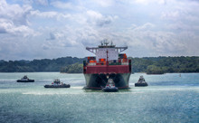 January 28, 2019, Panama Canal, Panama. Tug Boats Pulling Large Ship To Enter Locks Of The Panama Canal