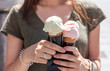 woman hands holding ice cream in waffle cone