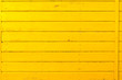 Section of yellow wood panelling from a seaside beach hut. Perfect as a background for Summer Holiday or seaside themes.